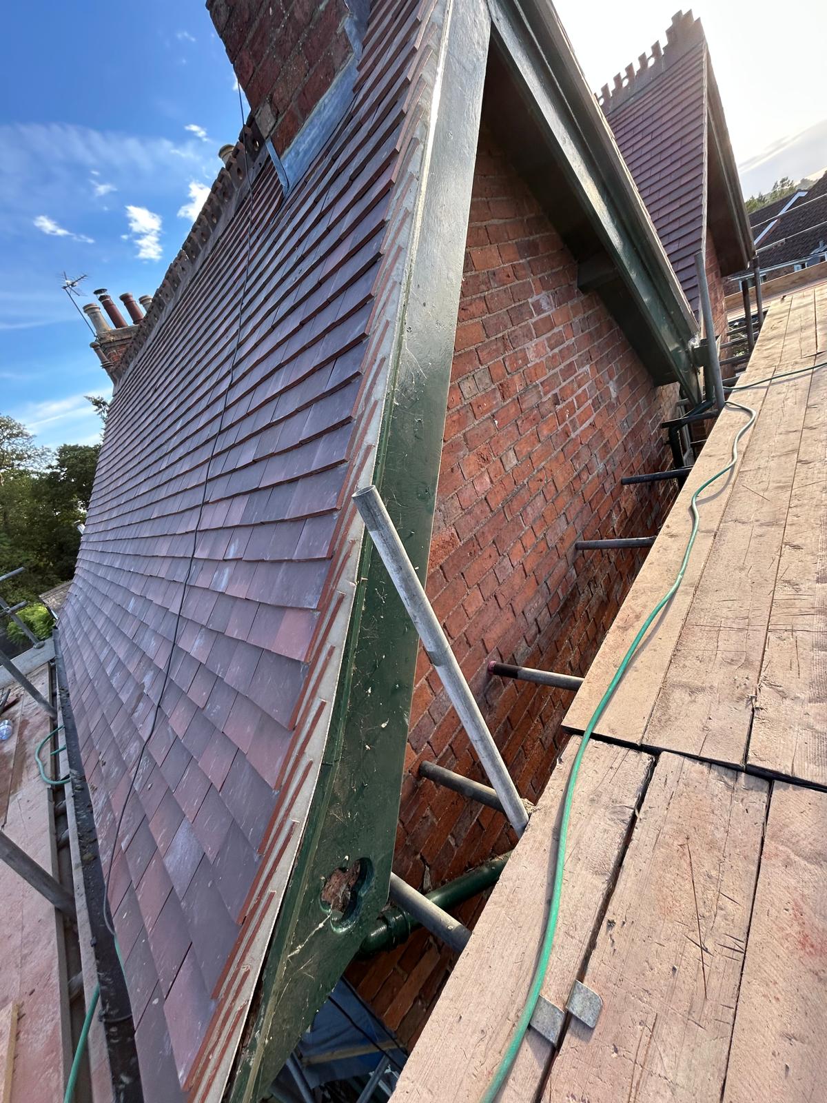 Ridge tiles and lead flashing installation