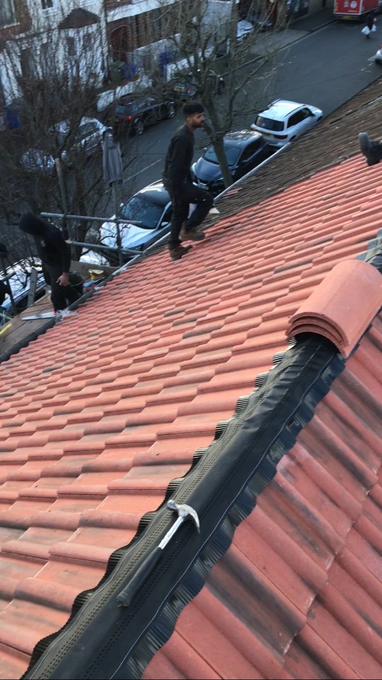 Slate roof and gutter installation